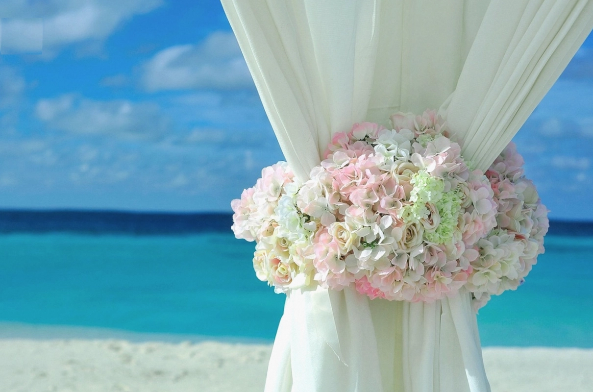Four matching bridesmaid posies in sage and cream